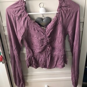 New, unworn purple ruched top, size small.